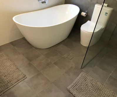 A modern contemporary bathroom renovation showcasing sleek fixtures and a stylish layout